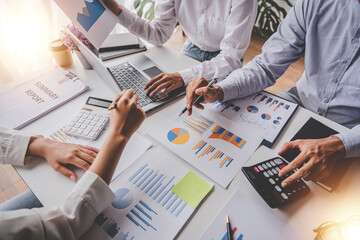 Young colleagues discuss business brainstorming and price charts analyze business people at the desk brilliantly in modern collaborative office teamwork ideas. Calculate personal tax for customers