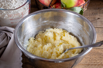 Cornish apple pie cooking step by step, step 2 - mixing butter with sugar, horizontal, selective...