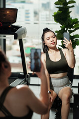 Sportswoman Taking Selfie in Gym