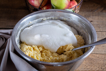 Cornish apple pie step by step, step 5 - adding beaten egg whites to the dough, horizontal,...