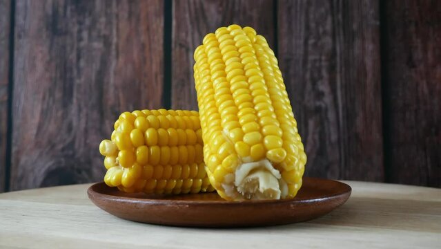 piece of sweet corn and seeds closeup, rotating
