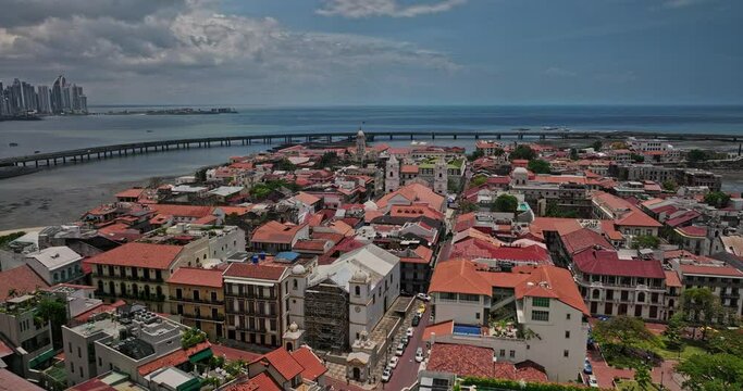 Panama City Aerial v104 low flyover casco viejo historic district capturing old quarter town with spanish colonial architectures and orange roof building complex - Shot with Mavic 3 Cine - April 2022