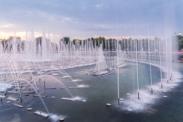beautiful fountain in the park at sunset