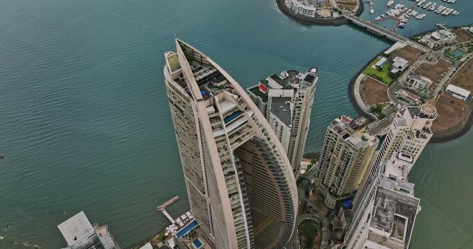 Panama City Aerial v14 birds eye view fly around downtown skyscrapers capturing waterfront luxurious hotel towers and oceanfront condominiums at punta pacifica - Shot with Mavic 3 Cine - March 2022