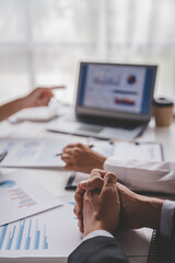 Young colleagues discuss business brainstorming and price charts analyze business people at the desk brilliantly in modern collaborative office teamwork ideas. Calculate personal tax for customers