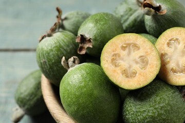Fresh green feijoa fruits in bowl, closeup