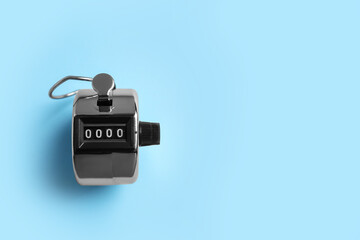 Modern timer on light blue background, top view. Space for text