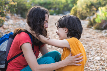 Fototapeta premium A boy hugs his mother, mother's hugs