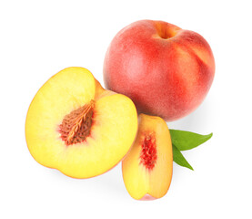 Whole and cut delicious peaches with green leaves isolated on white