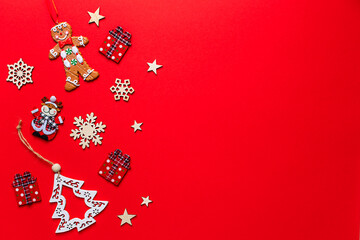 Christmas holiday composition on a red background. Christmas decorative greeting card. Copy space, flat lay, top view.
