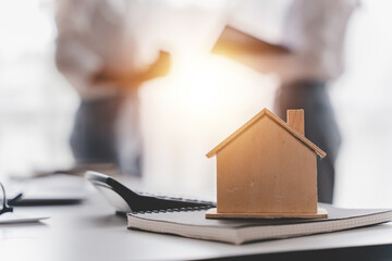 focus house model real estate agent blur background Deliver the sample house to the customer...