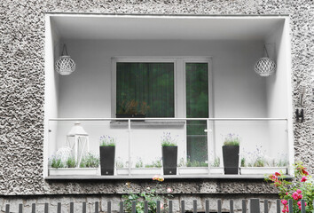 Balcony decorated with beautiful plants and lanterns
