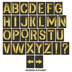 Kit. Alphabet made of letters, made of wood, on a dark wooden plank. Isolated on white background. Education. Design