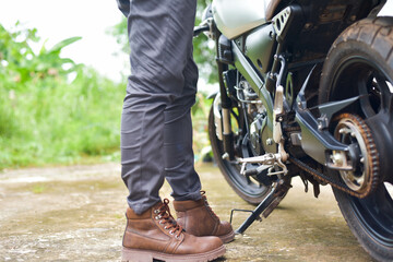 Naklejka premium Biker with motobilk on nature background.