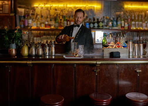 Bartender Preparing A Bloody Mary On An Authentic Wooden Bar Counter. 