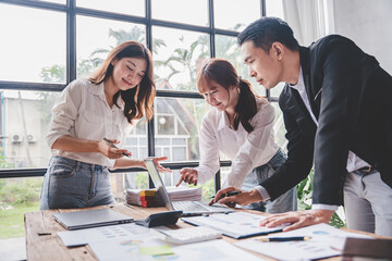 Young colleagues discussing business and price chart analyzes business people on the table great in modern coworking office teamwork concept. Calculate personal tax for customers