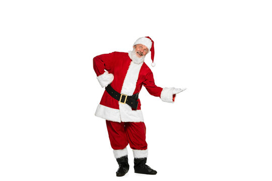 Portrait of senior man in image of Santa Claus posing with positive expression isolated over white background. Proposal