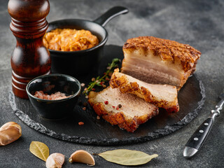 Roasted pork belly. Crispy Roast Pork Belly with stewed cabbage and spices. CLose-up
