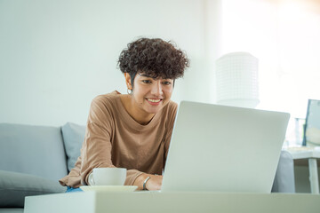 Woman shopping online via laptop computer,Using credit card for online shopping,Finance and debit,Lifestyle concept.
