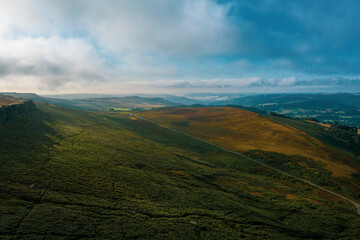 Fototapeta premium Stanage Edge in Peak District, England, UK. Derbyshire Magnificent landscape of rock formations and moorland at Stanage Edge in the Peak District in Derbyshire. Aerial. Drone. 