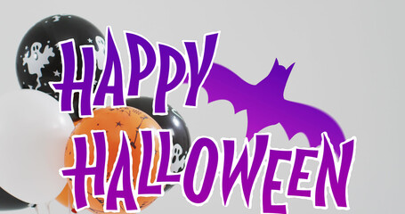 Image of halloween text over balloons and bat on grey background
