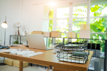 Paper documents and bills for paying online and computer on table in home office,Paper correspondence for managing budget or expenses,Finance concept.