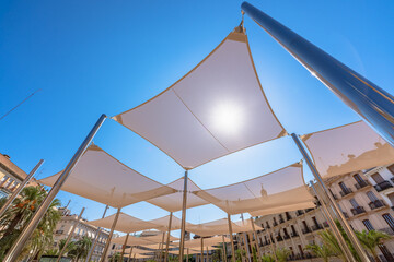 Modern structure that provides shadow in summer located in Plaza de la Reina, Valencia, Spain