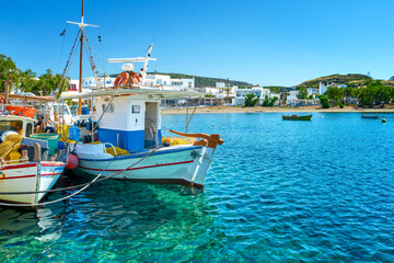 Naklejka na ściany i meble Beautiful view of Greek fishing boats anchored in a small village
