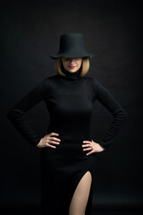 Fototapeta na wymiar Woman portrait in black hat