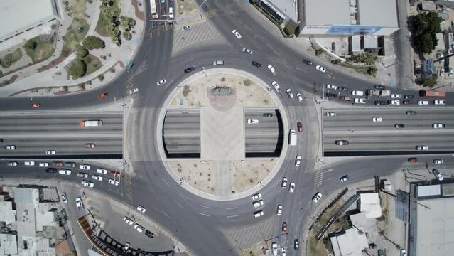 Cenit view from a drone ascending over a roundabout