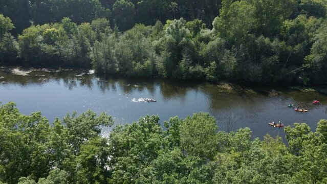 Aerial view kayakers and canoes on river water in nature of Canada