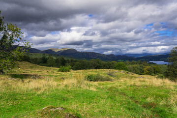 View of English Lake District with dramatic sky, mountains and lake, dramatic sky	


