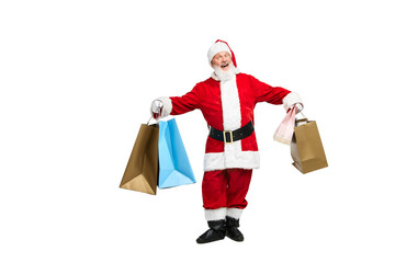 Portrait of senior man in image of Santa Claus with many shopping bags isolated over white background