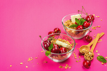 Summer breakfast concept. Healthy morning food. Ripe cherries, milk, white chocolate, and granola