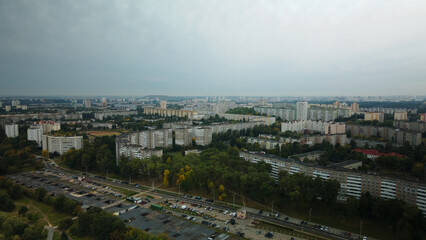 Multi-storey buildings with infrastructure. Densely populated urban area. Overcast weather. Aerial photography.