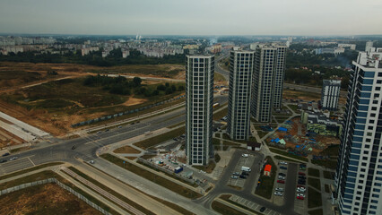 Modern urban architecture. Multi-storey buildings with infrastructure. Densely populated urban area. Overcast weather. Aerial photography.