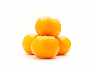 Pile of fresh oranges on a white background