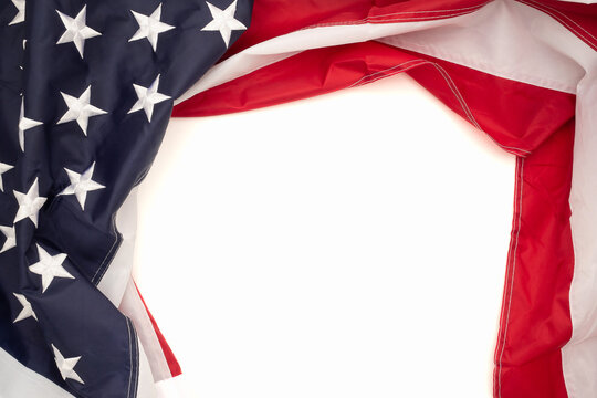 Top view of the American flag on a white background with copy space for text