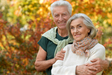 Nice elderly couple in a autumn park