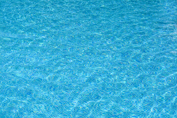 Clear refreshing water in swimming pool on sunny day, closeup