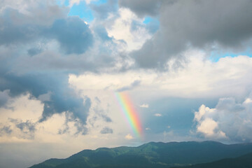Picturesque view of sky with clouds and rainbow