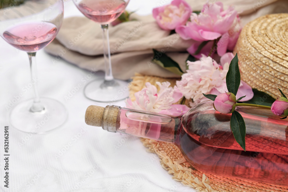 Sticker Bottle of rose wine and peonies on white fabric