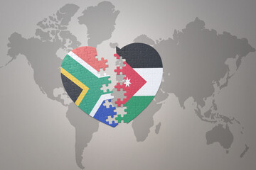 puzzle heart with the national flag of south africa and jordan on a world map background. 3D illustration