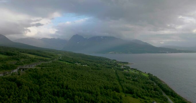 Cloudy Sky Over Green Forest Landscape Near European Route E8 In Nordkjosbotn, Norway. Scenic View Of Balsfjord And Mountains At Daytime. aerial drone