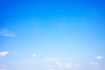 Blue sky background and white clouds soft focus, and copy space horizontal shape.