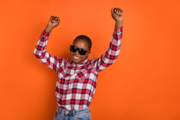 Photo of positive pretty girl enjoy have fun dancing spend pastime isolated on orange color background