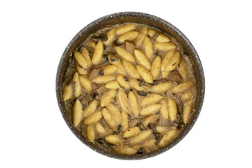 dumplings made of mashed potatoes, eggs, and flour with mushrooms and lamb