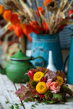 Colorful autumn flowers on a garden table