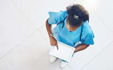 Doctor, tablet and healthcare website with blank mockup screen while standing and working in a hospital from above. Medical insurance app, nurse and 5g network for innovation in health and medicine