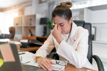 Stress business woman busy and tired from overwork. young adult Asian professional manager having...